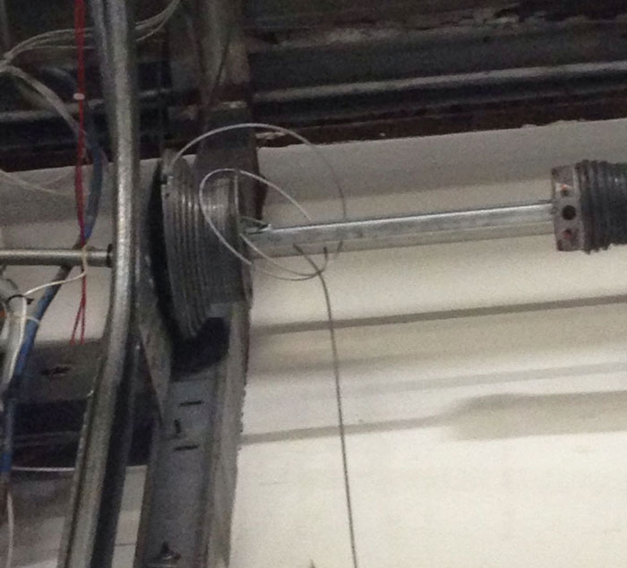 Snapped garage door cable